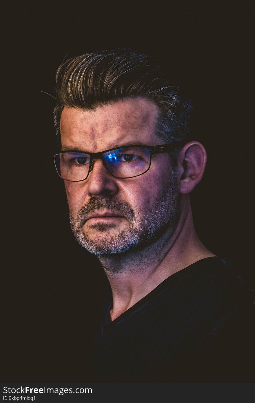 Close-Up Photography of a Man Wearing Eyeglasses