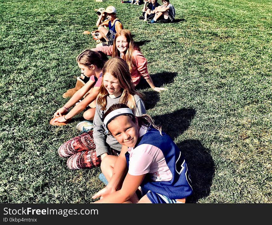 Photography of People On Grass Field