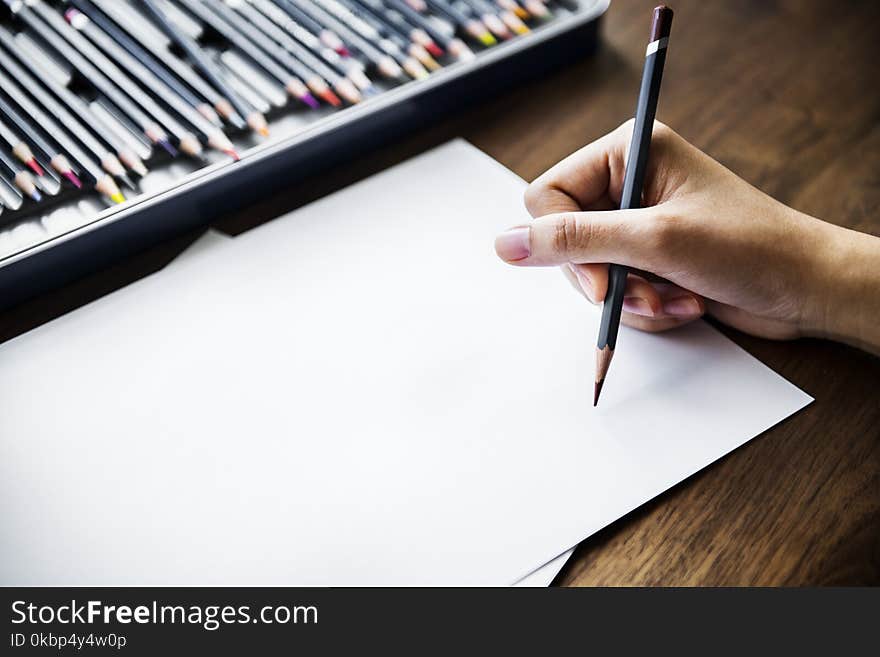 Person Holding Black Pencil