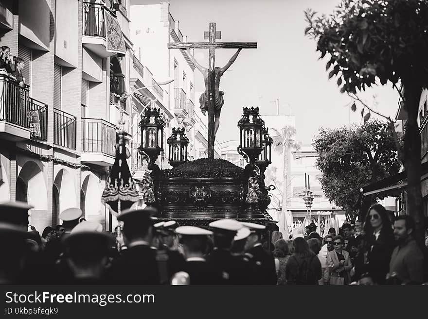 Greyscale Photo Of Group Of People Carrying Crucifix