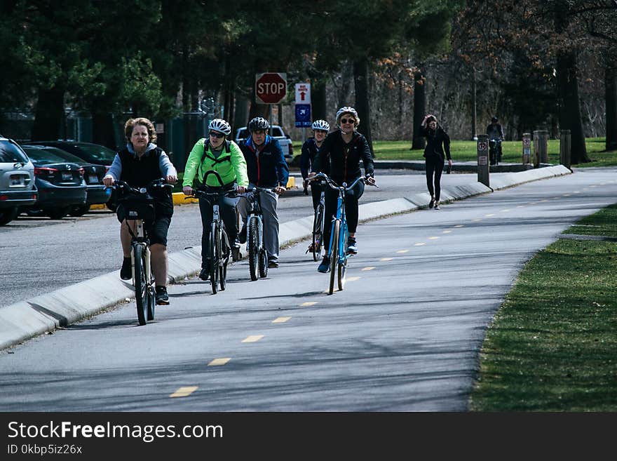 Five Person Riding Bikes