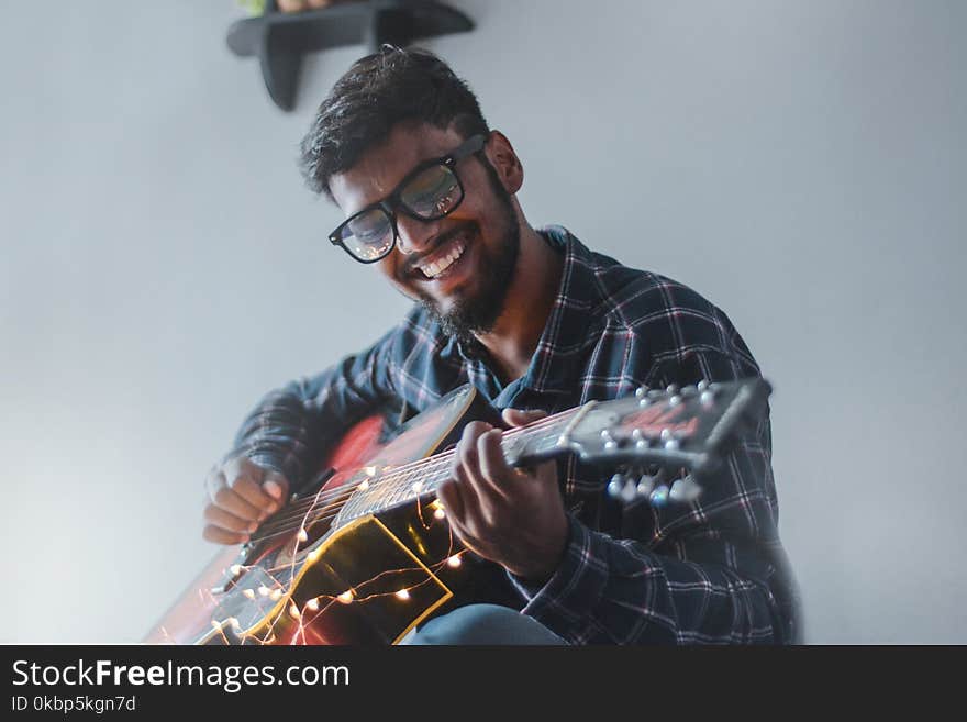 Man Playing Guitar