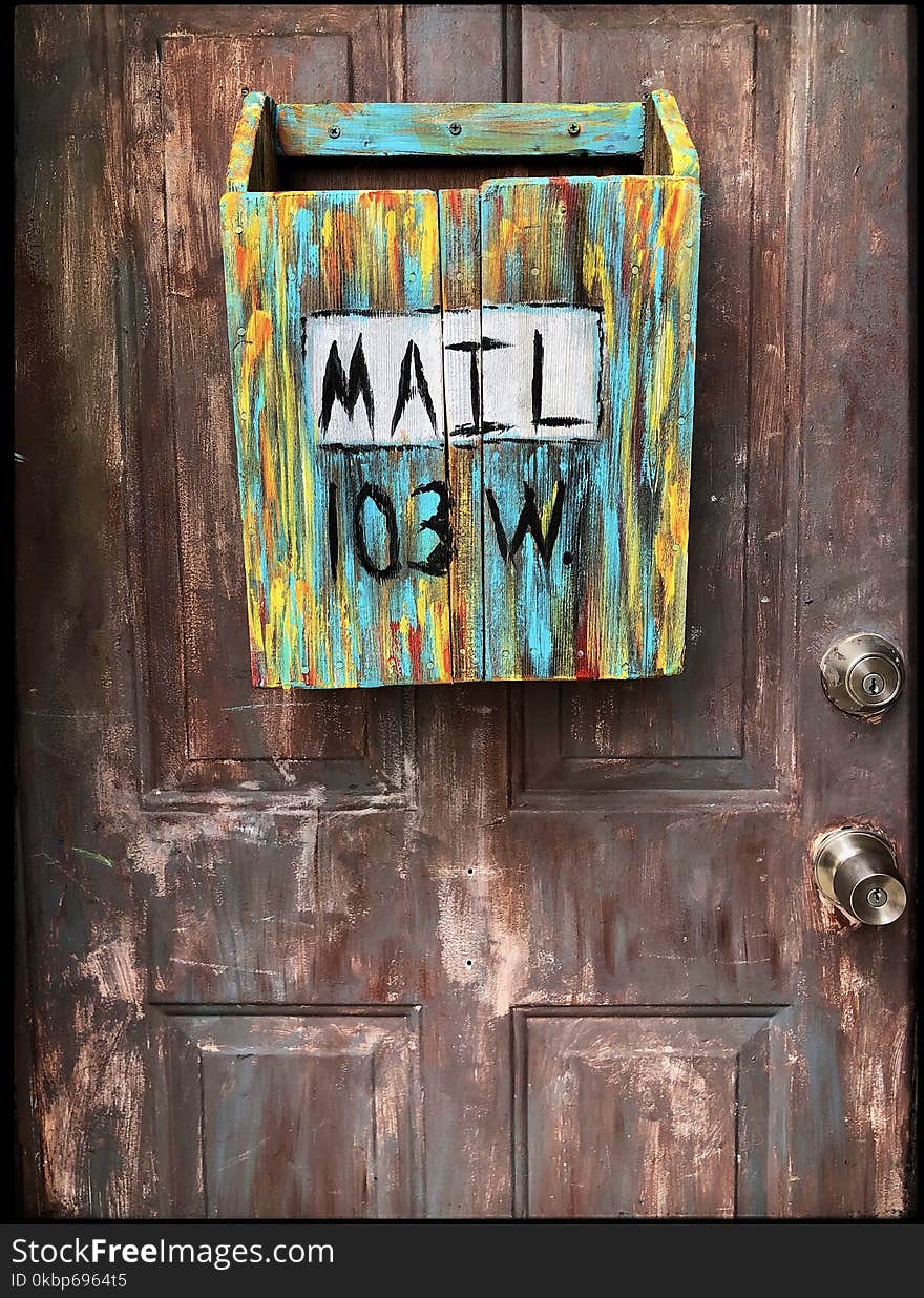 Multi-coloured Wooden Mailbox Mounted On Door