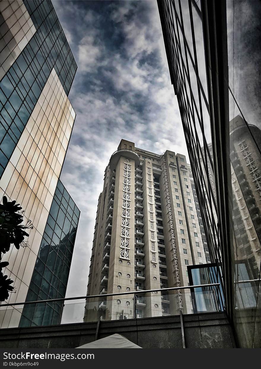 Low-angle Photo of Brown and Gray Concrete Building