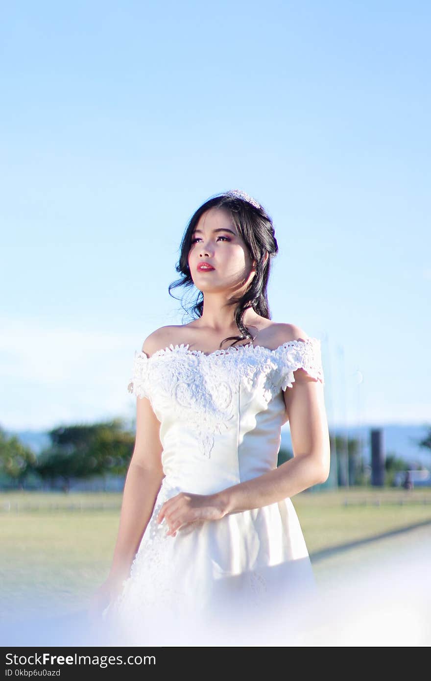 Woman Wearing White Off-shoulder Wedding Dress