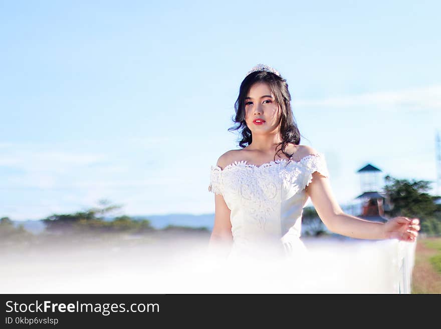 Woman In White Off-shoulder Gown