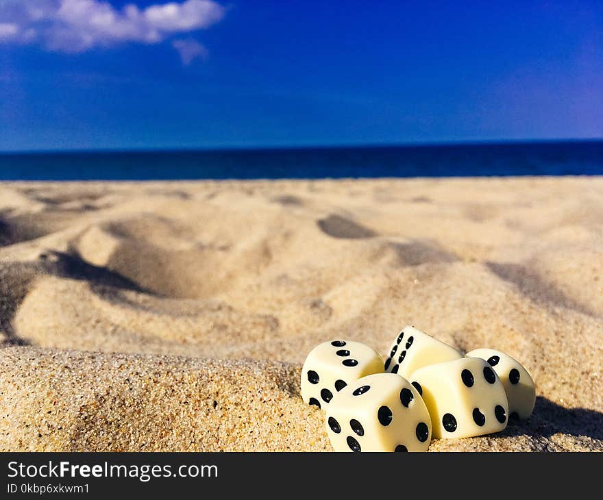 Five Dice on Sand