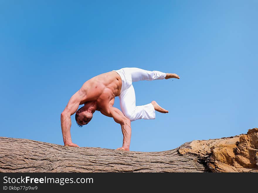 Man Wearing White Pants Under Blue Sky