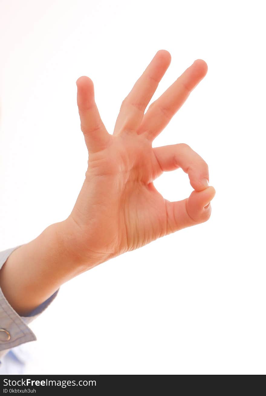 Child`s hand showing a positive gesture OK