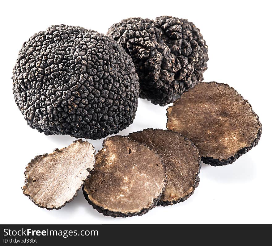 Black truffles isolated on a white background.