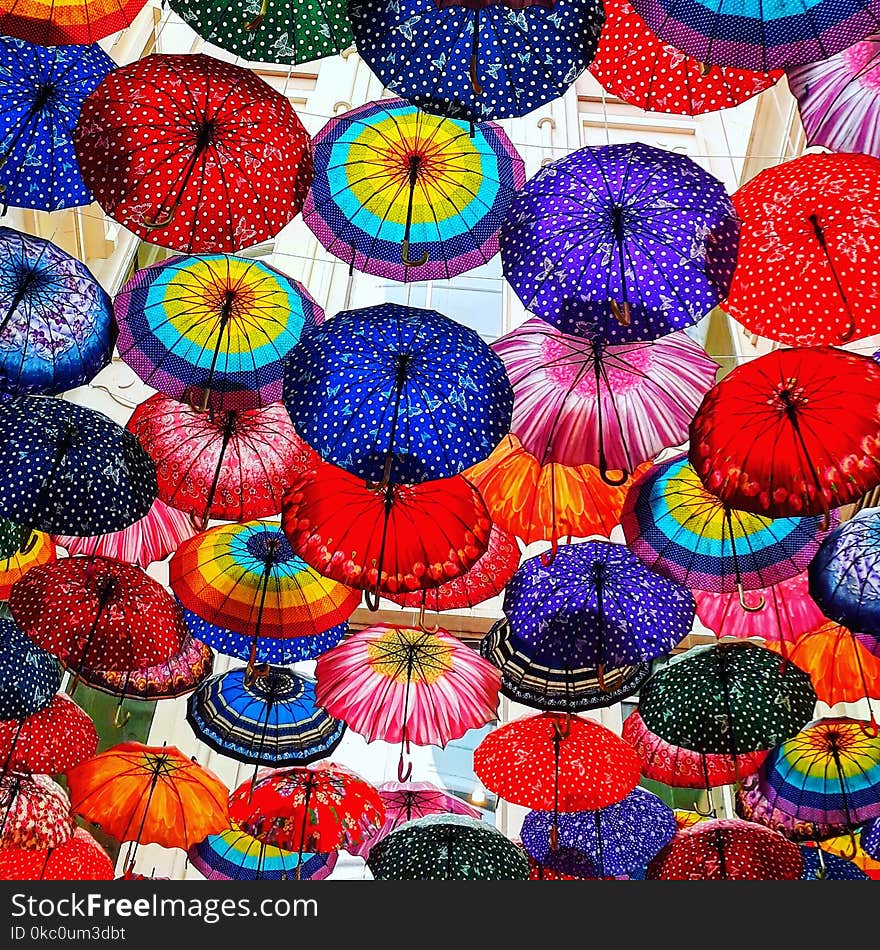 Under colorful umbrellas. Under colorful umbrellas