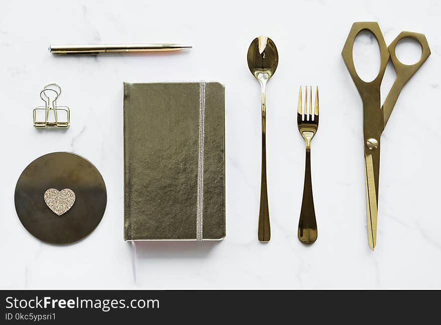 Top-view Photography of Silver Spoon, Book, Fork, Scissors, and Pen