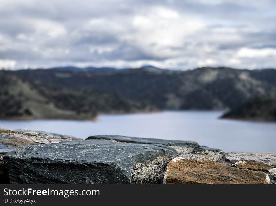 Photography of Lake Between Mountain at Daytime