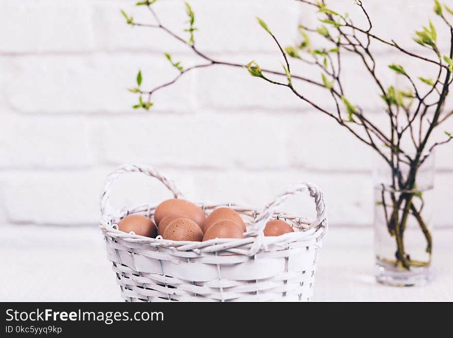 Bunch of Poultry Egg in White Wicker Basket