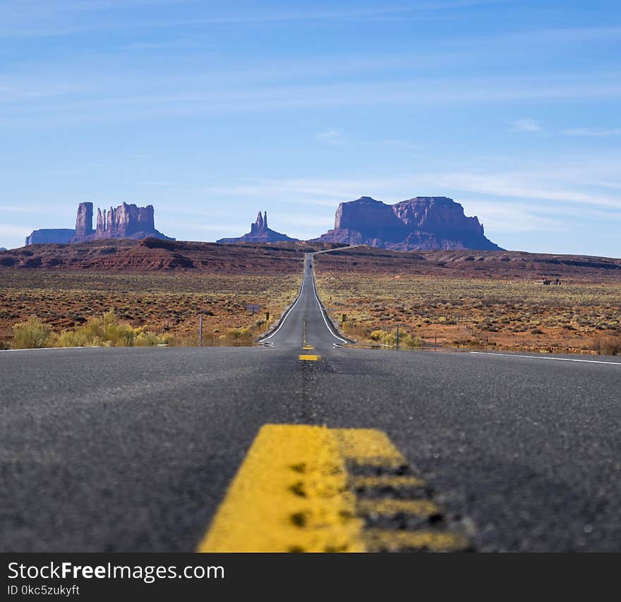 Focus Photo of Roadway Going Towards Mountains