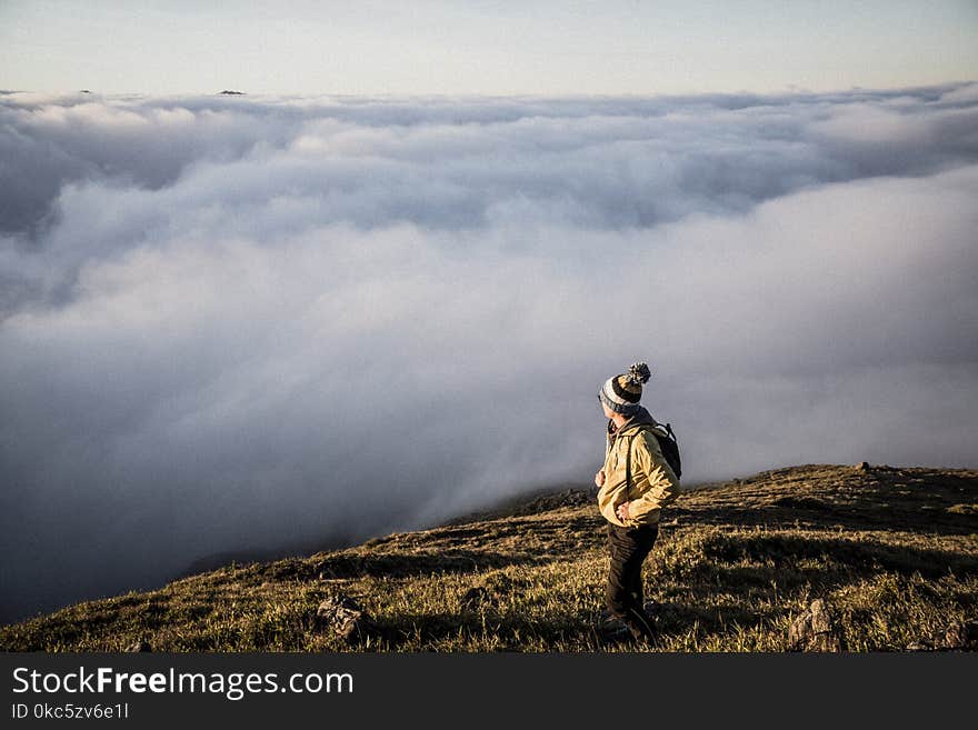 Man Standing on Top of Moutain