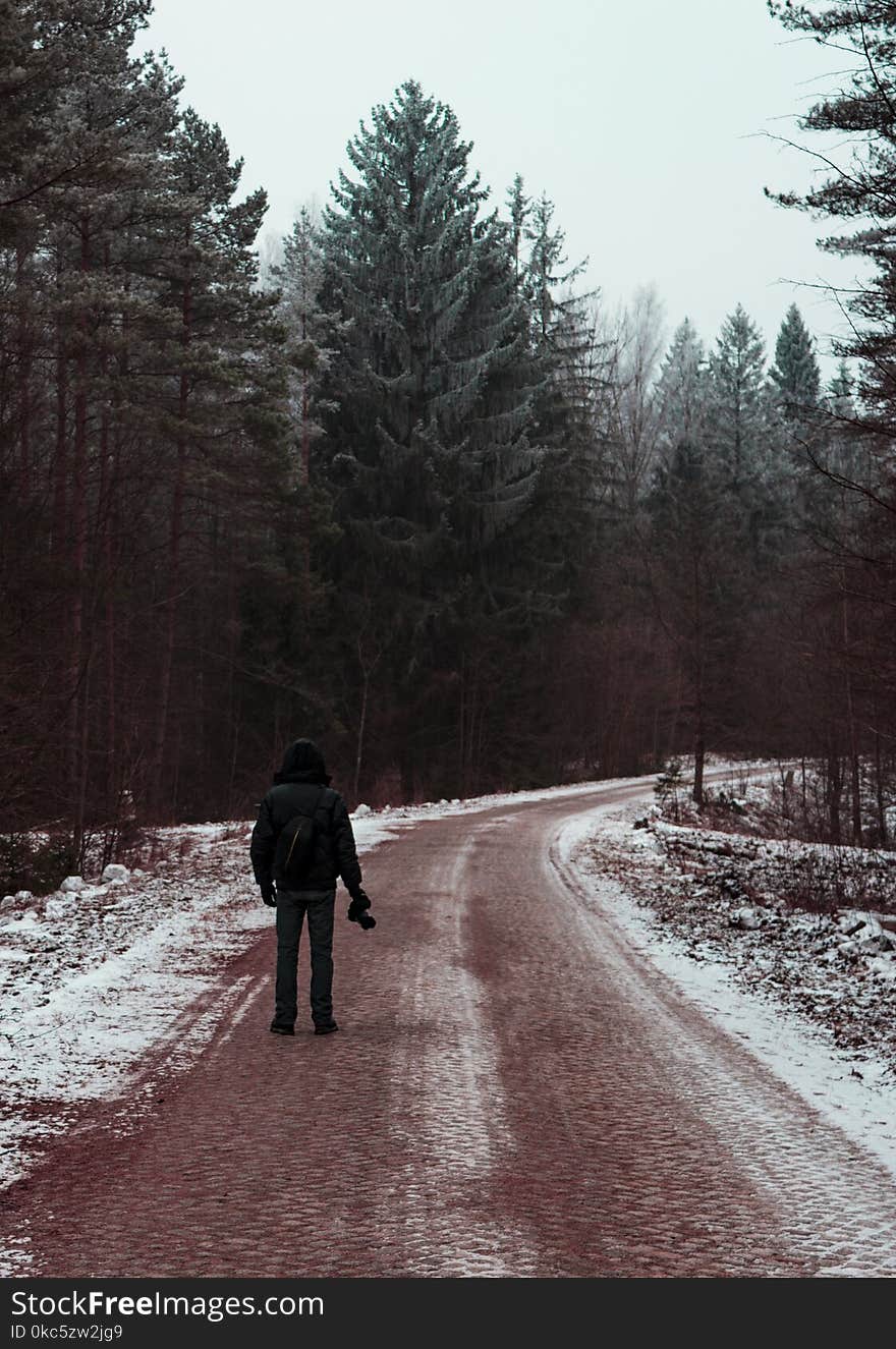 Man standing in the middle of the road