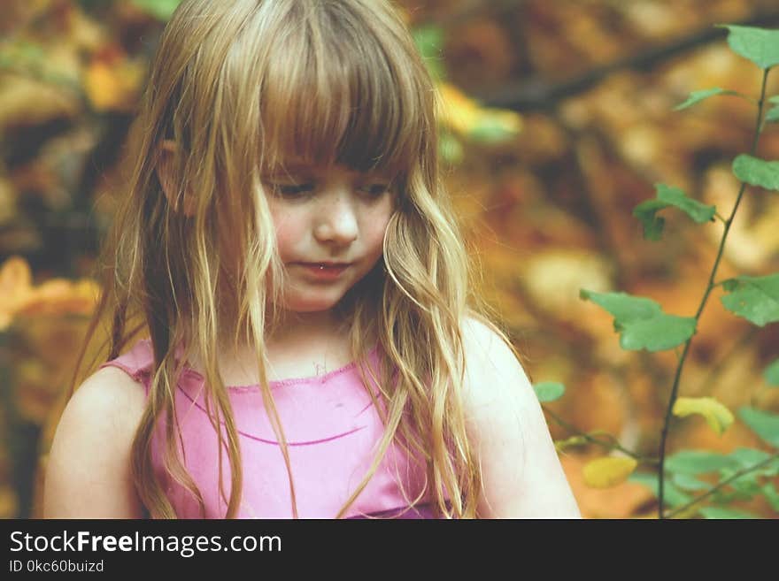 Girl Wearing Pink Sleeveless Dress