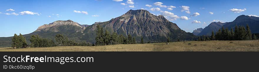 Brown Mountain Under Blue and White Sky