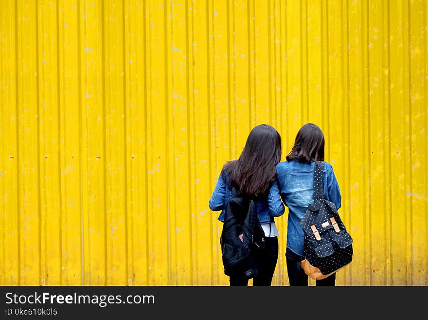 Two Women In Denim Jackets