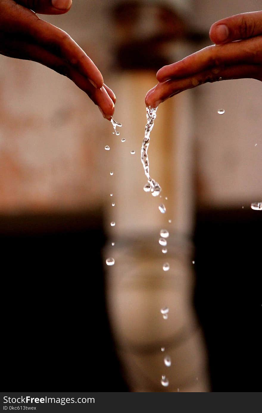 Hands With Drops Of Water