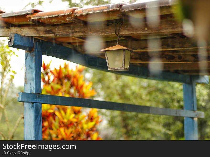 Lantern Hanging On Brown Wooden Ceiling