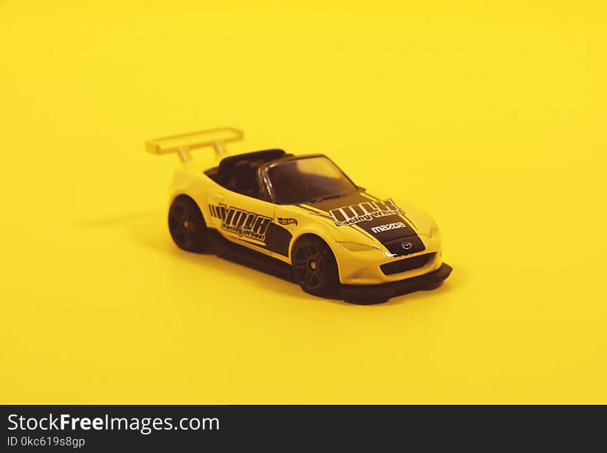 Yellow And Black Toy Car Model