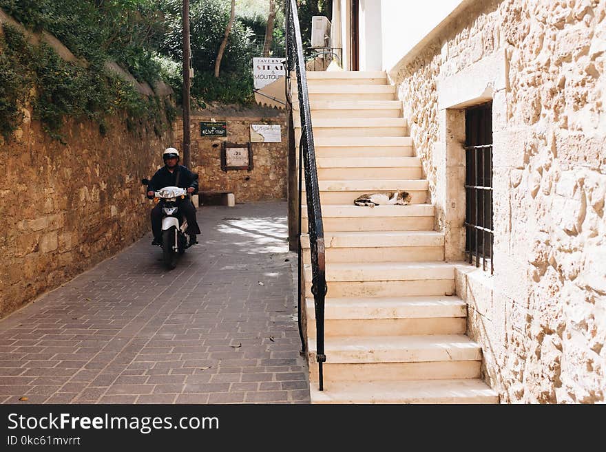 Man Riding White Motorcycle