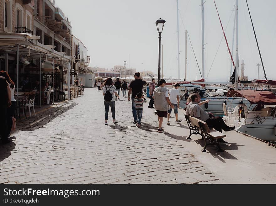 People On Dockside Pavement