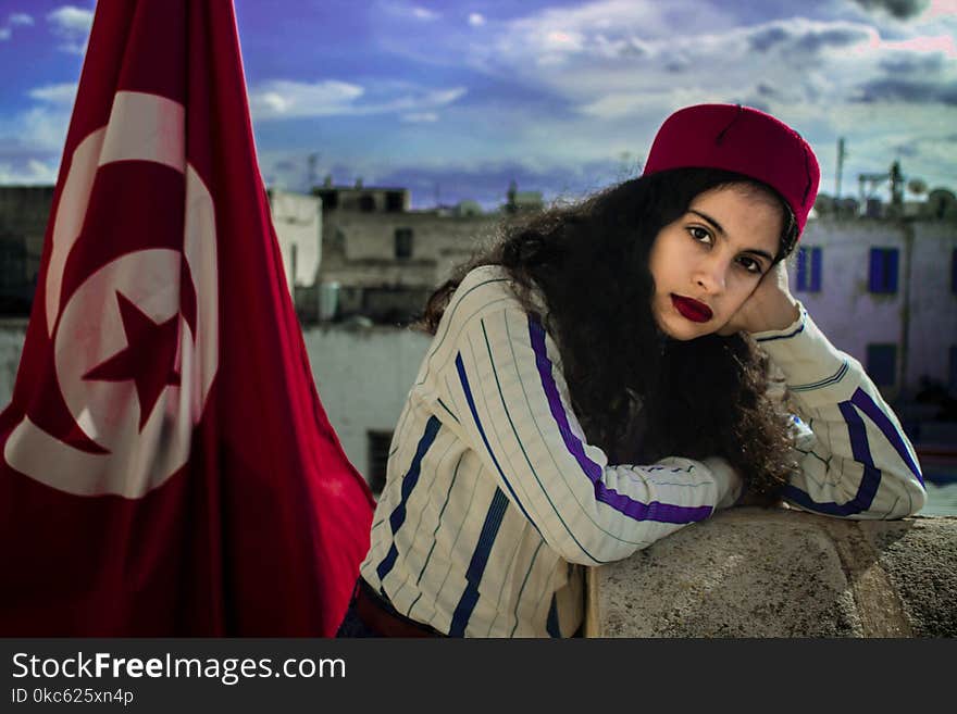 Woman Wearing White And Purple Long-sleeved Top Beside Turkey Flag