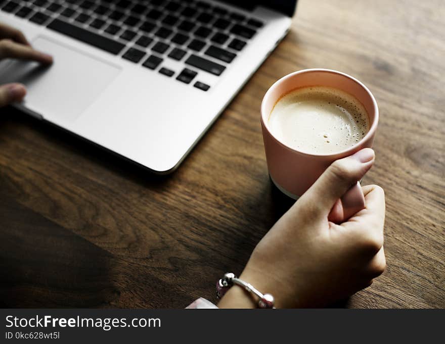 Hand On Cup Of Coffee