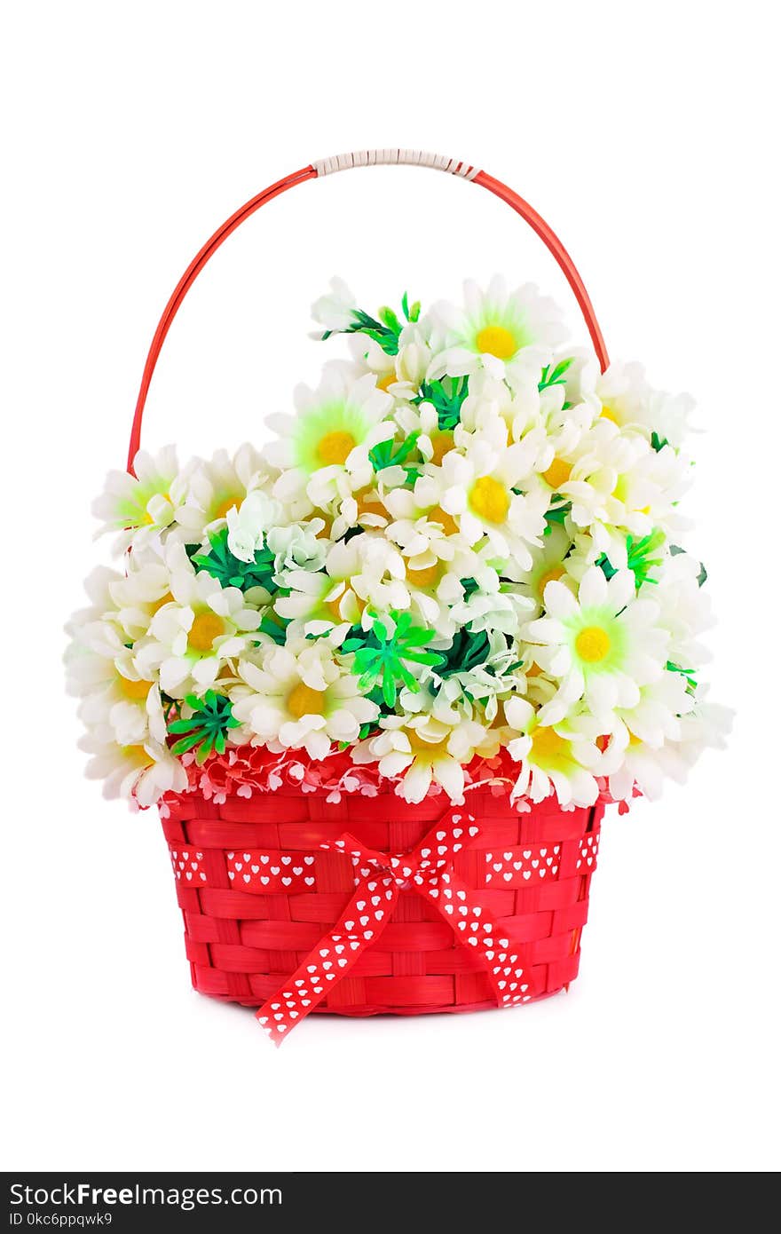 Fabric daisies in wicker basket isolated on white background. Fabric daisies in wicker basket isolated on white background.