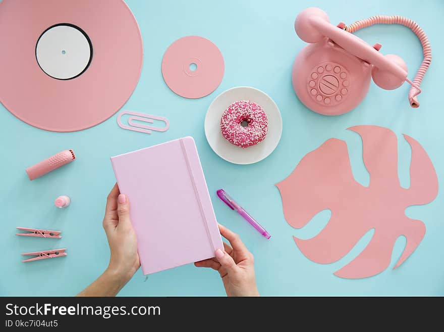 Freelancer with pink notebook