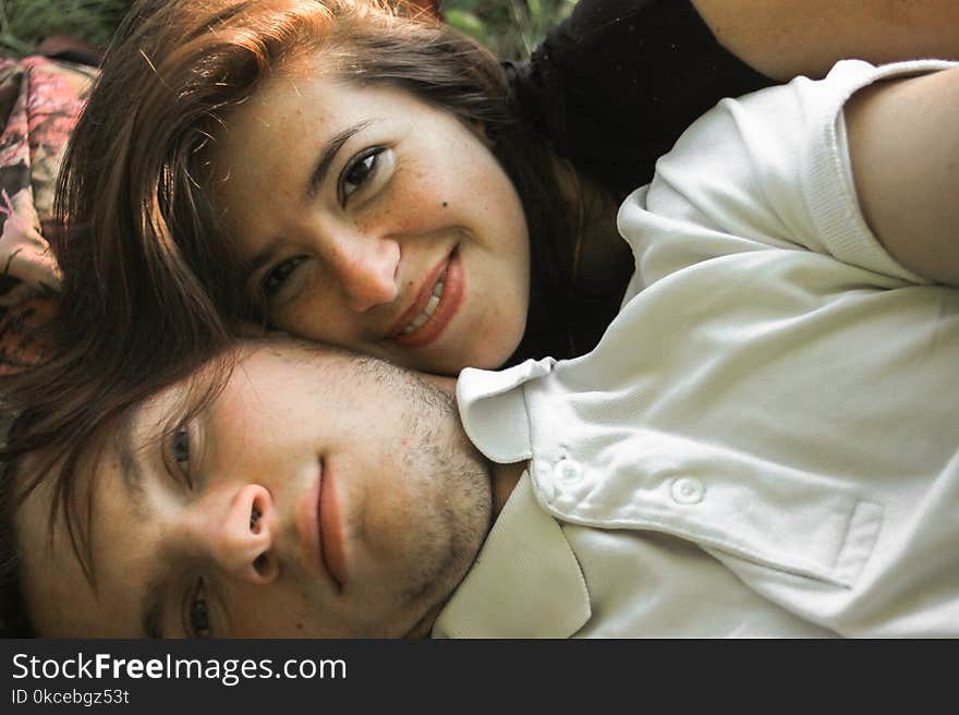 Happy couple faces having fun on a summer picnic, tender feeling