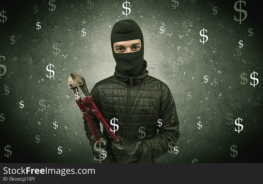 Money hungry thief in black clothes and tolls on his hand. Money hungry thief in black clothes and tolls on his hand.