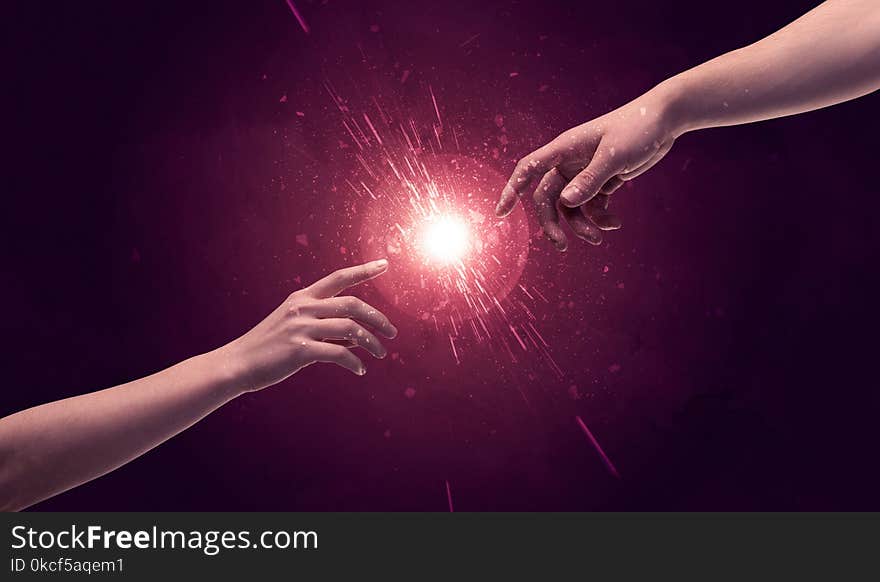 Touching hands light up sparkle in space