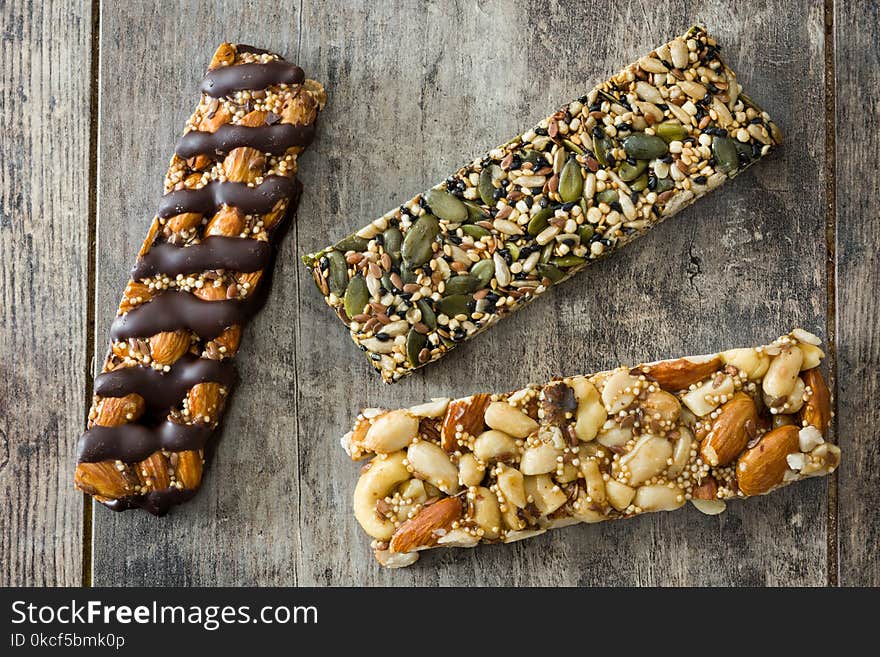 Muesli bars on wooden table.