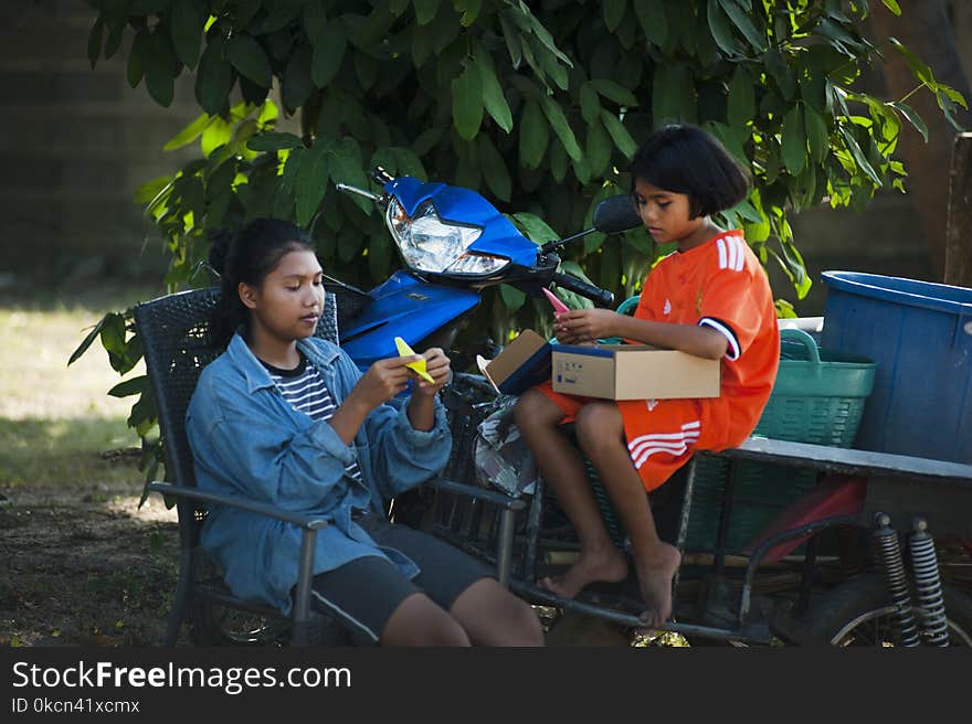 Two Girls Doning Hand Crafts