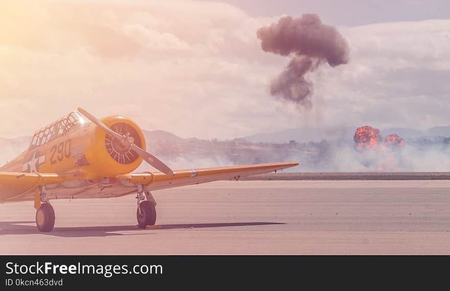 Yellow Biplane on Runway