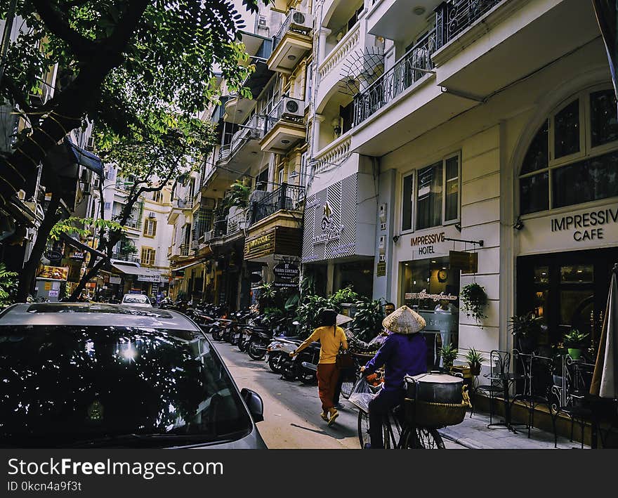 People Walking in Front of Buildings