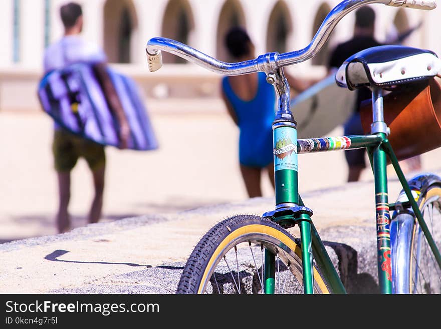 Selective Focus Photography of Green Bike