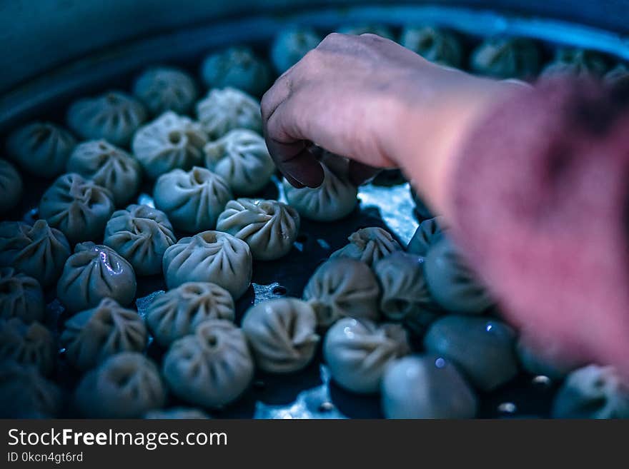 Person Holding Dumplings