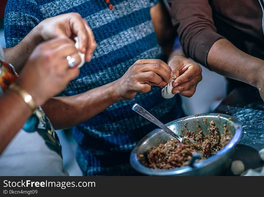 Photo of People Making Dumplings.