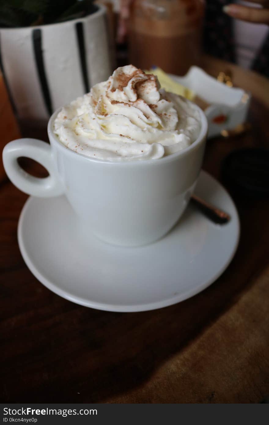 White Ceramic Cup With White Cream