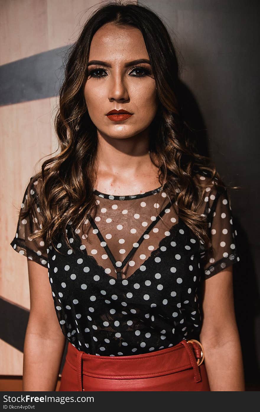 Photography of a Woman Wearing Polka-dot Shirt