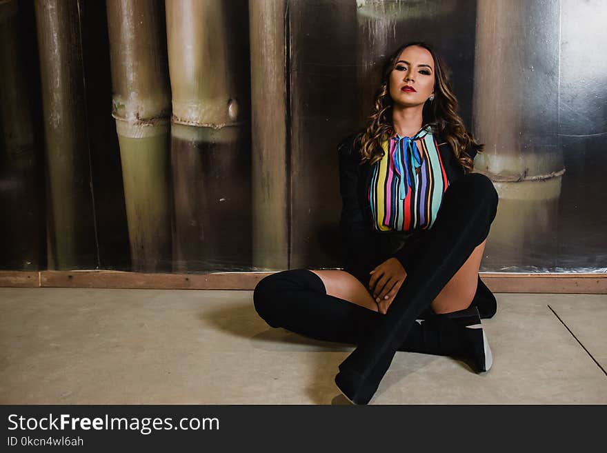 Photo of Woman Sitting on the Floor