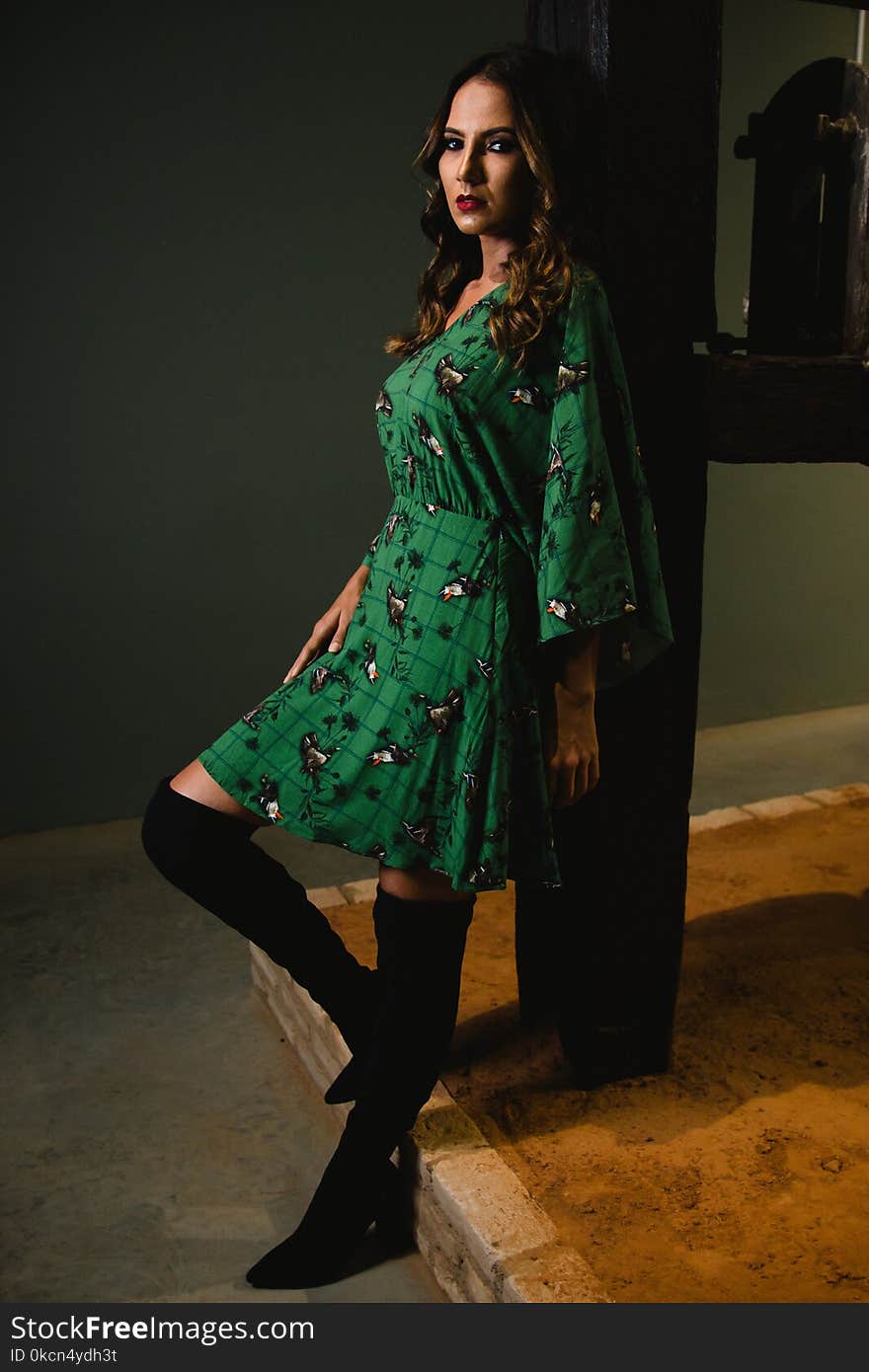 Photo of Woman Wearing Green Dress