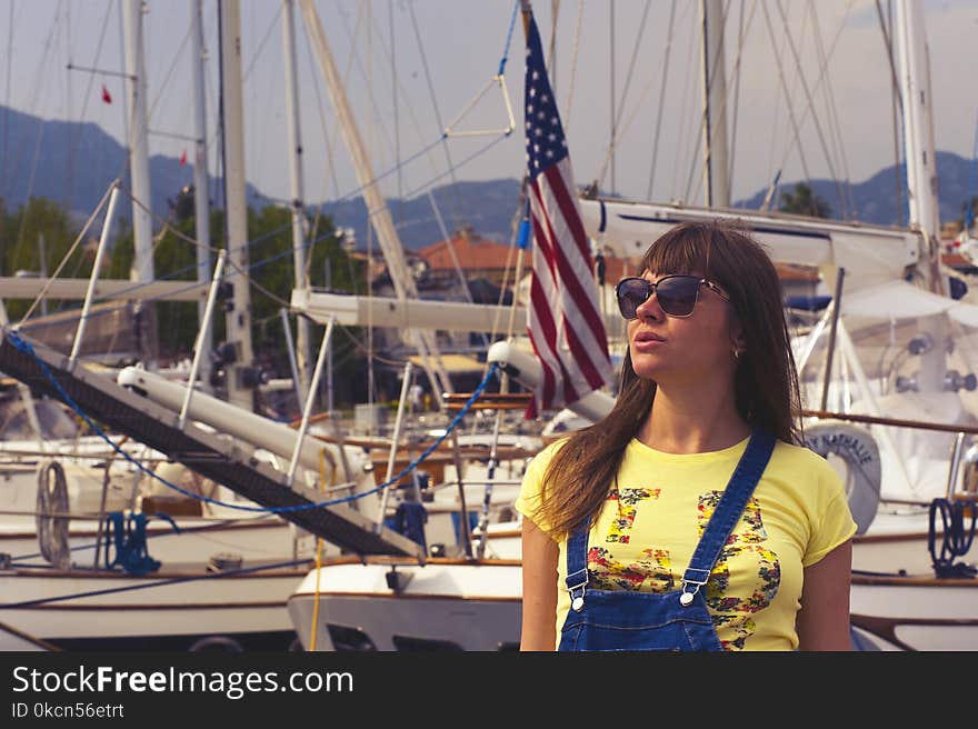 Woman Wearing Sunglasses and Yellow Top