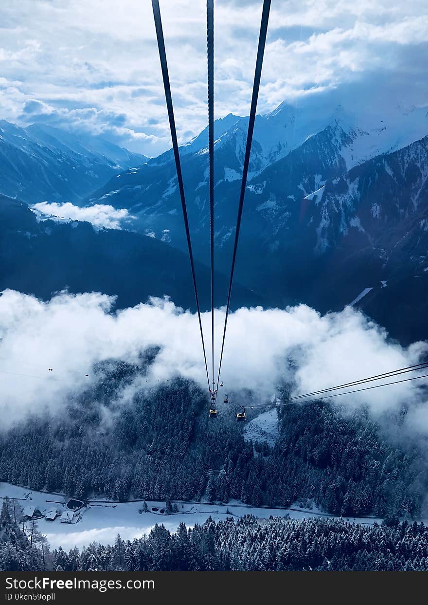 Cable Car Under White Clouds