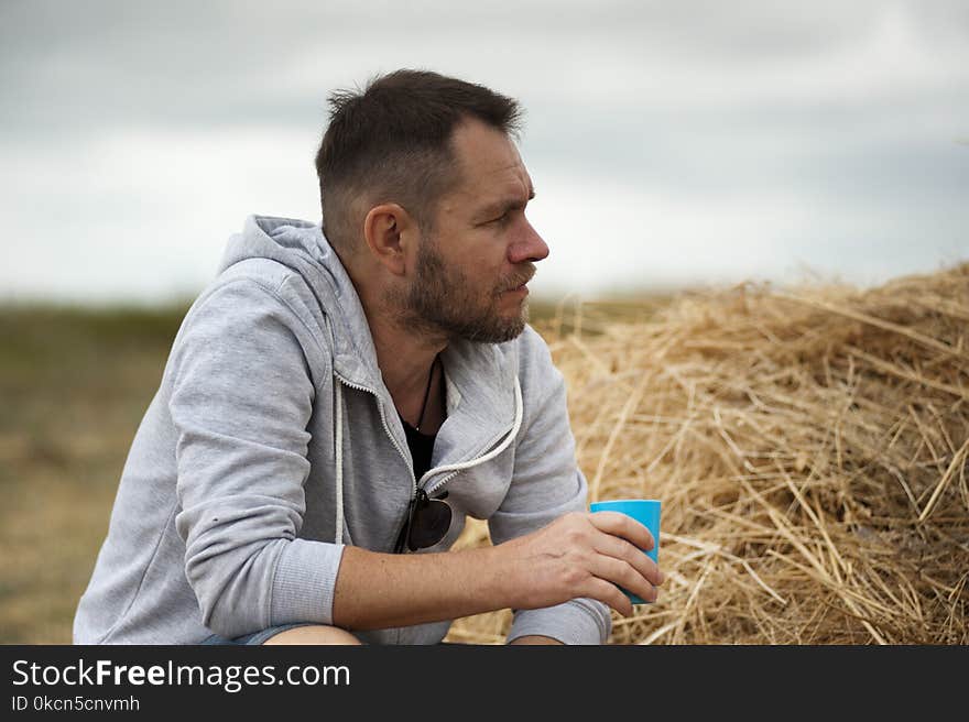 Shallow Focus Photography of Man in Gray Hoodie